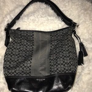 Black coach prude with tassels